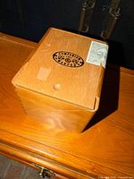 Top and side view showing wedge shape, logo, tax stamp