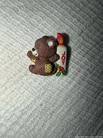 Front view showing bear and candle design