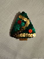 Front view of sequin Christmas tree brooch