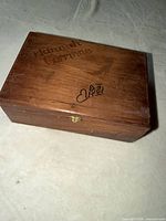 Top view closed wooden box showing engraving and clasp