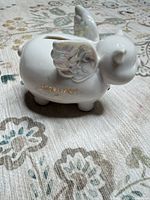 Left side view showing February gold text and wings