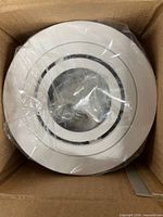 View of one Halo recessed light in its protective plastic inside carton