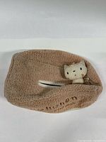 Overall view of fleece tissue box cover showing interior slot and cat plush accent