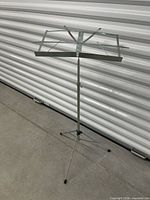 Full view of unfolded metal sheet music stand