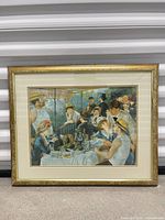 Full view of framed Renoir print showing frame, mat, and artwork