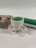 Close-up of Hot Head candle holder and clothespins