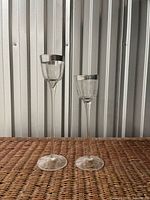 Pair of tall stemmed glasses front view