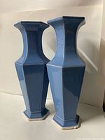 Two blue faceted ceramic vases front view