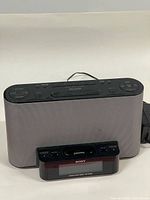 Front view of Sony ICF-CS10iP dock with speaker grille and cradle