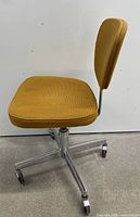 Front angled view showing seat, backrest, and chrome base with casters