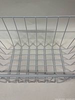 top view of white wire basket showing interior grid and base dimensions