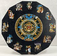 Full view of black wood wall plaque with cloisonné Aztec calendar and surrounding figures