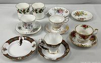 Group shot of all teacups, saucers, mugs and plate