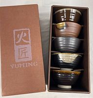 Box with Yuming branding and stacked bowls inside