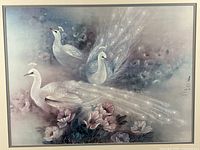 Close view of print showing two white peacocks and floral scene