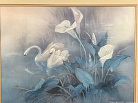 close view of swans, lilies and blue tonal artwork