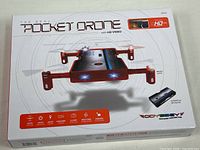 Front of sealed retail box showing drone image and branding