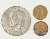 Obverse of Eisenhower Dollar and two Wheat Cents