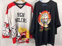 Front view of both jerseys hanging