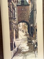 Close view of street scene print showing architectural arch and figures