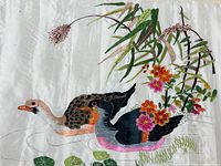 Full view of embroidered silk showing both ducks, flowers, bamboo