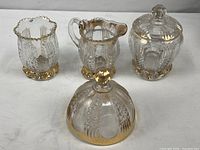 Group shot of all four pressed glass pieces