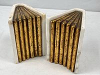 Both marble bookends showing front gilt ridged faces