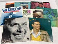 Group shot of eight vinyl albums—six Nat King Cole, two Frank Sinatra