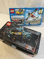 Front view of both LEGO set boxes, showing Technic 42059 and City 60019