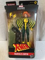 Front view of sealed Marvel Legends Siryn figure in packaging with accessories visible