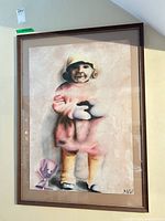 Entire framed pastel portrait hanging on wall