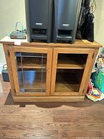 Front view showing glass panel door and open door without glass