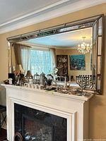 Mirror over fireplace showing full front view