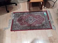 Full view of rug showing pattern and overall wear