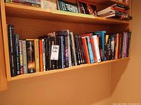 Full shelf showing variety of textbooks and comics