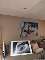 Both paintings and poster displayed for scale and context