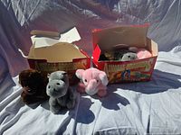 Three plush animals and two boxes overview