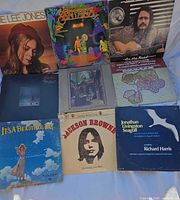 Nine LP covers laid out in three rows showing artwork and titles clearly