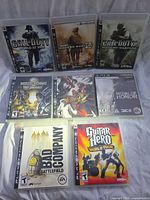 Front view of all eight PS3 game cases