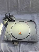 Top view of PS1 console with controllers and memory card inserted