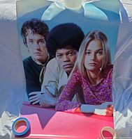 Full view of poster showing all three cast members