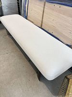 Full view of white linen bench top and part of base