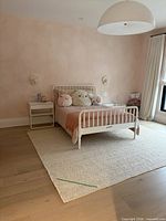 Assembled Jenny Lind bed in room setting showing design and scale