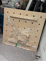 front view of pegboard with accessories shrink-wrapped