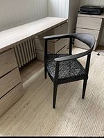 Desk assembled showing light oak finish, six drawers, and desktop