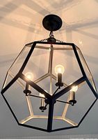 Chandelier installed and lit showing overall design and finish