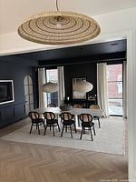 Table in dining room with eight chairs for scale