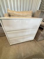 Front view of white 3-drawer dresser