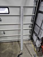 Full length view of projector screen in aluminum housing