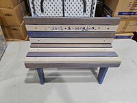Front view of painted child bench showing personalization